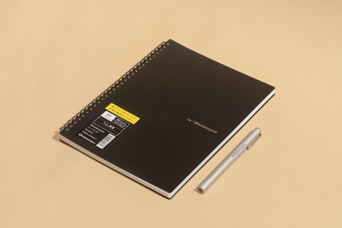 Maruman Mnemosyne N194A Special Memo Notebook next to a pen